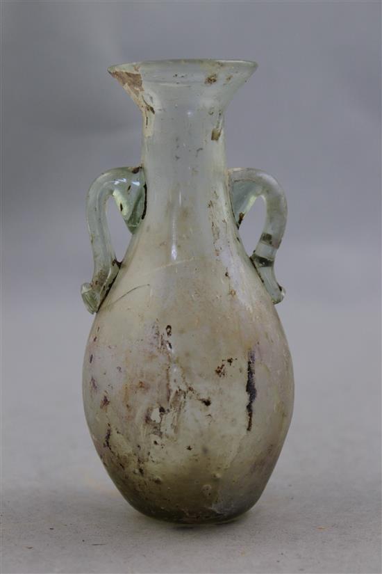 A Roman clear glass two handled bottle vase, c.2nd century AD, 12.5cm